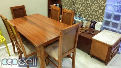 Teak wood Dining table I paid 53000at Damro I am selling for 20000 2 